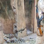 Malian Soldier Waiting With His Weapon